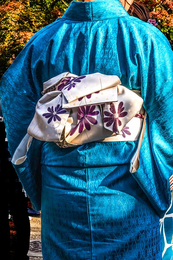 Colorful blue traditional Japanese kimono white obi, Kiyomizu Buddhist Temple, Kyoto, Japan.